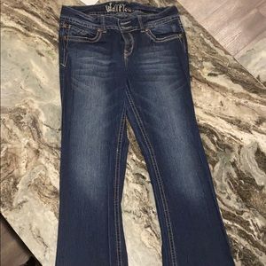 Medium wash flare leg jeans. Stretch.